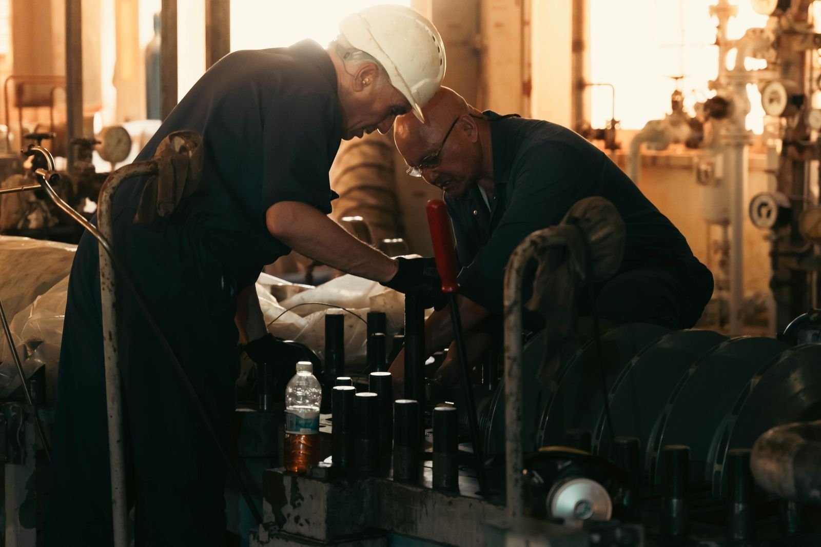 Engineers carrying out machinery maintenance