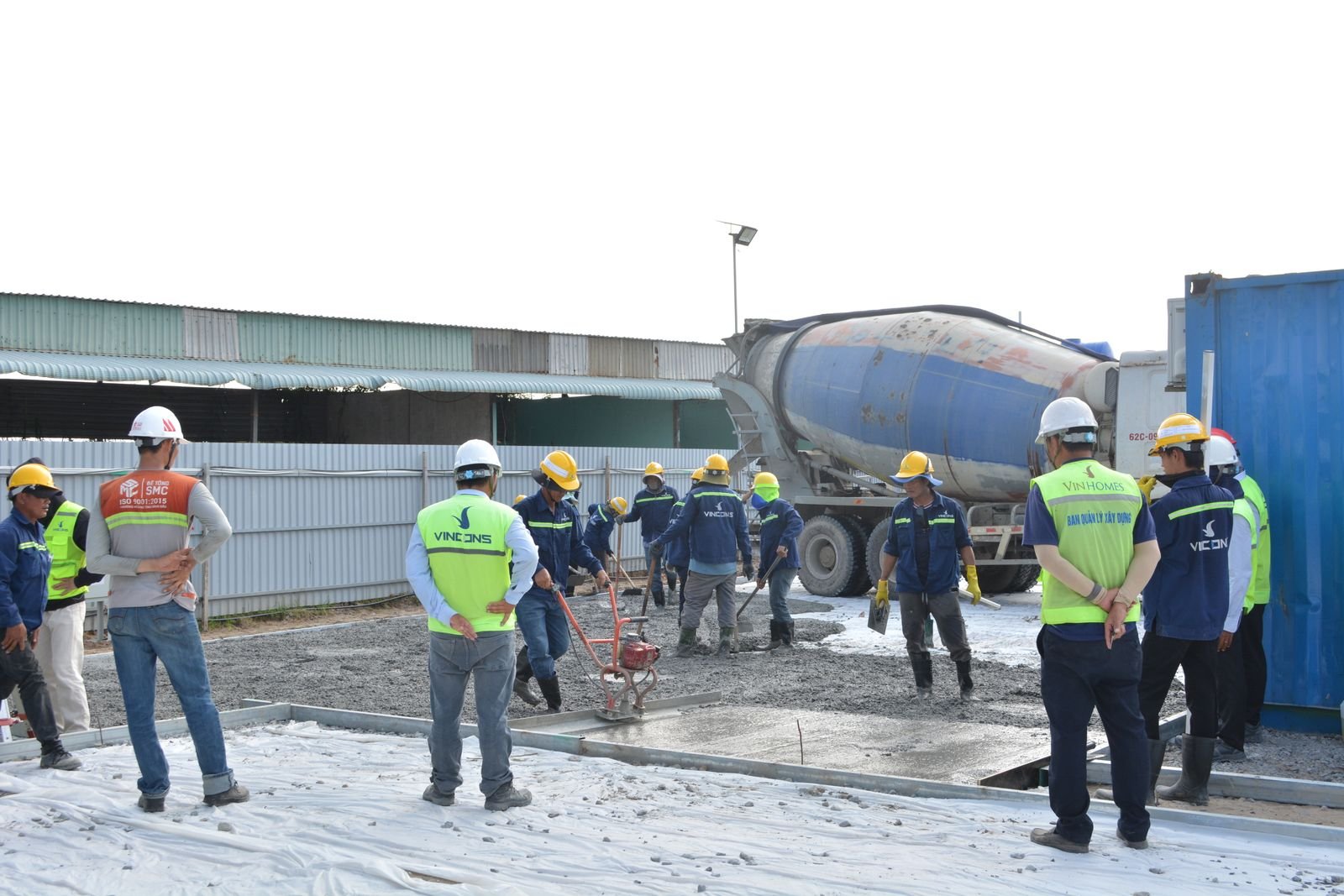 Construction crew pouring concrete