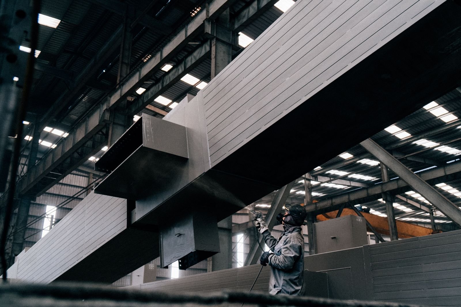 Spray painting large steel beams