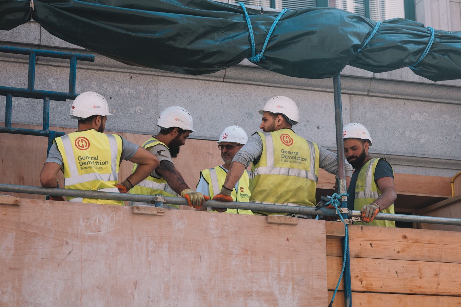 Construction workers in hard hats on site