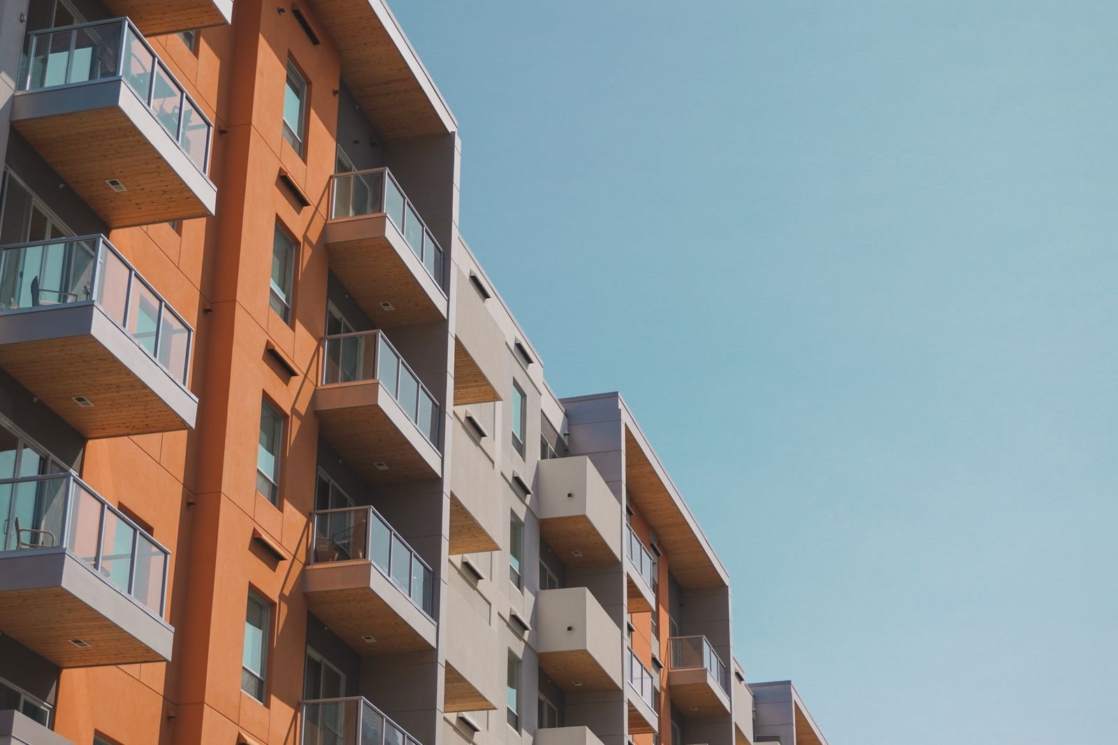 Modern apartment building with glass balconies
