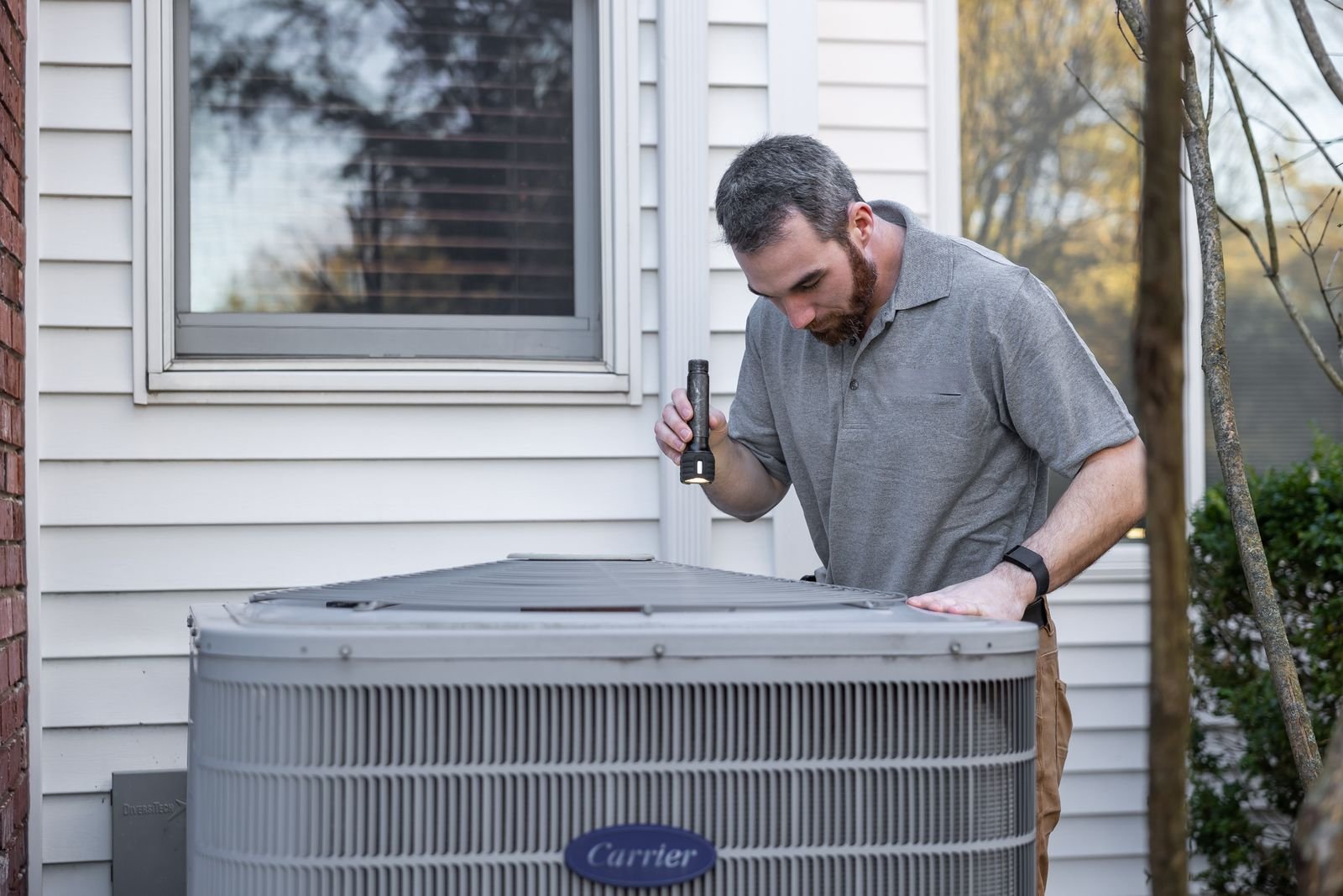 Technician servicing an HVAC unit